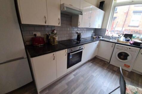 Bright and modern kitchen with ample countertop...