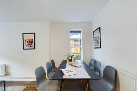 A bright and inviting communal workspace, perfe...