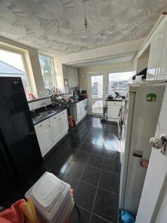 Bright kitchen with ample natural light from la...