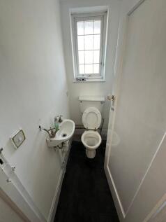 Compact and functional toilet room featuring a ...
