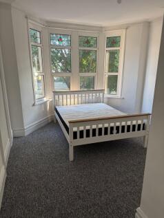 Bright and inviting double bedroom featuring a ...