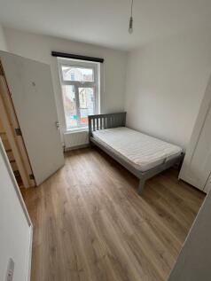 This charming double bedroom features a bright,...