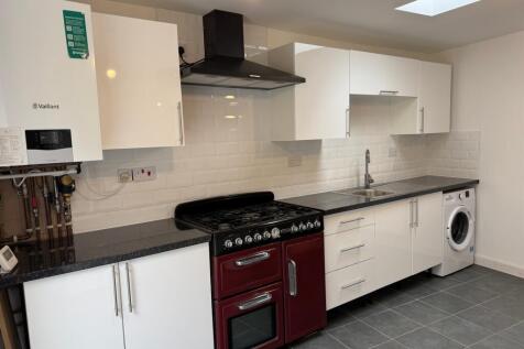 This modern kitchen features a stylish design w...