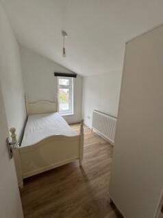 This charming double bedroom features modern wo...