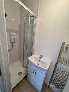 This modern bathroom features a sleek shower an...