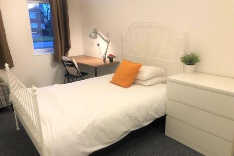 A bright and inviting double bedroom featuring ...