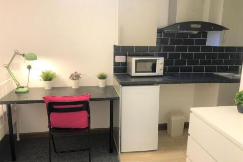 Bright and tidy kitchen space featuring modern ...