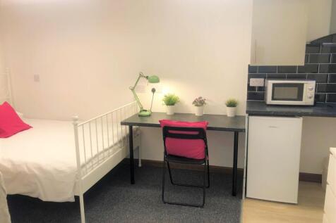 Bright and tidy single bedroom featuring a cozy...