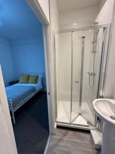 Bright and clean ensuite bathroom with a modern...