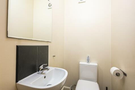 A well-maintained single toilet featuring a mod...