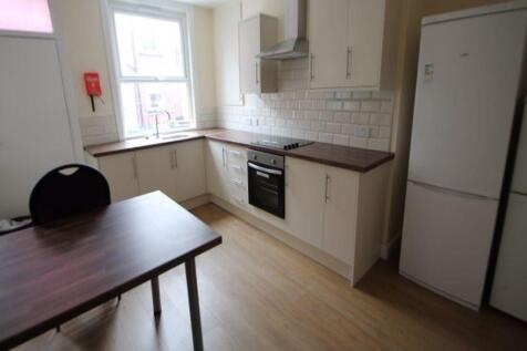 Bright and modern kitchen featuring ample count...