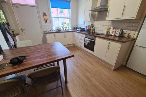 Bright and modern kitchen featuring ample count...