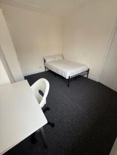 This inviting double bedroom features ample spa...