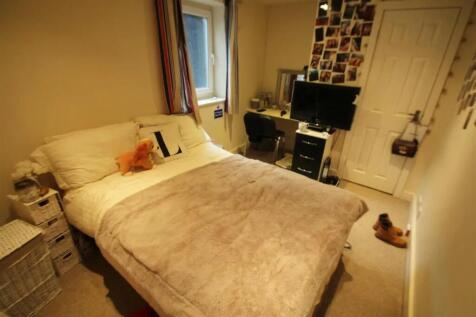 Cozy double bedroom featuring a comfortable dou...