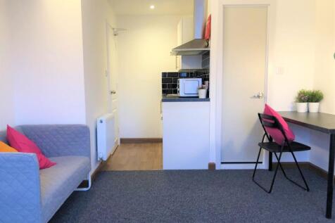 Bright and tidy living room featuring a comfort...