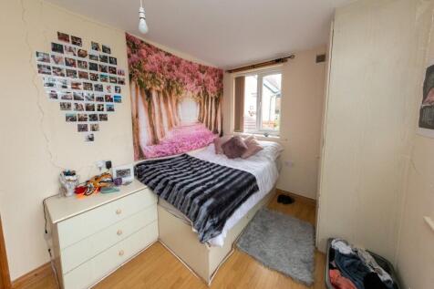 Bright and cozy bedroom featuring a single bed ...