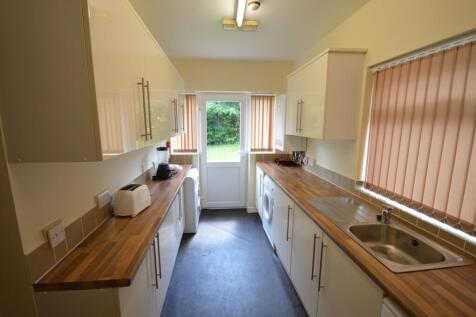 Bright and well-maintained galley kitchen with ...