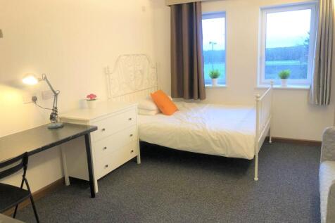 Bright and tidy single bedroom featuring a cozy...