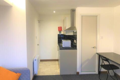 A compact, well-maintained kitchen area with mo...
