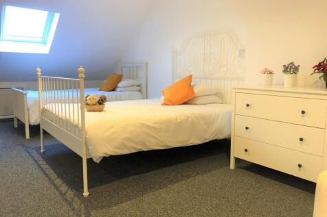 Bright and tidy double bedroom featuring two wh...