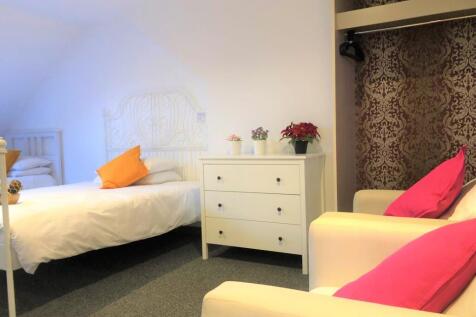 Bright and inviting double bedroom featuring a ...