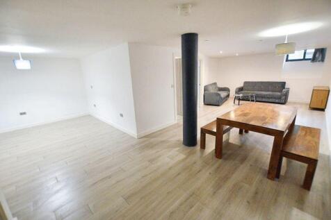 Bright and spacious living room featuring moder...