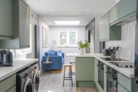 A bright and modern living room with large wind...