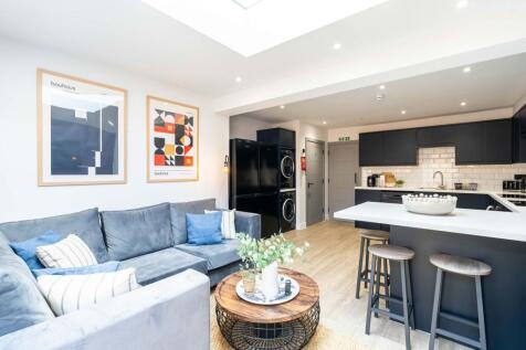 Bright, modern living room with stylish decor, ...