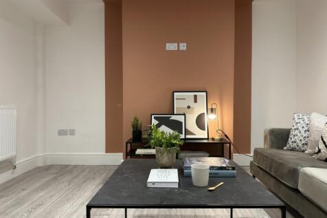 A stylish and inviting living room with modern ...