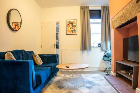 A bright and inviting living room with modern d...