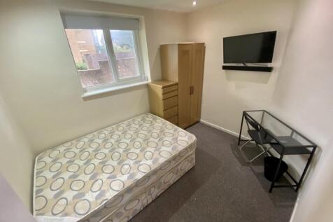 A cozy double bedroom featuring ample storage a...