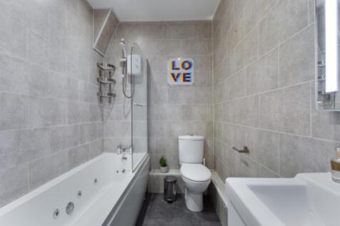 A modern and clean bathroom featuring a stylish...