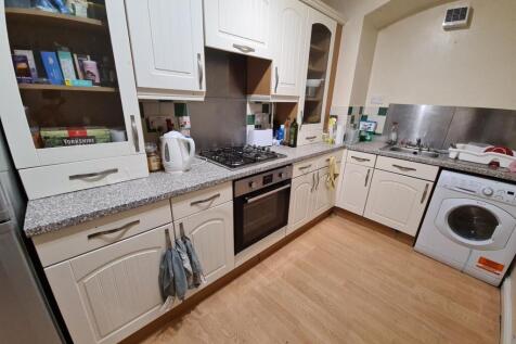 A well-maintained kitchen with ample counter sp...