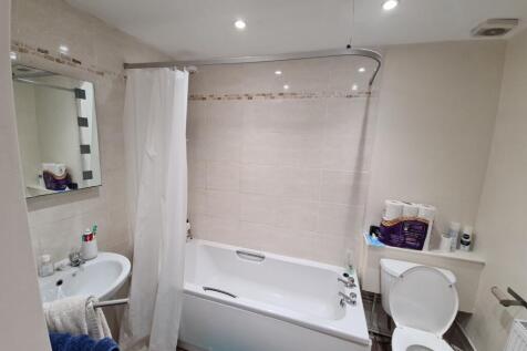 A clean and well-maintained bathroom featuring ...