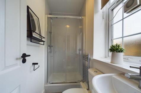 A bright and clean bathroom featuring a modern ...