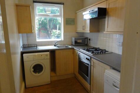Bright, functional kitchen with a large window ...
