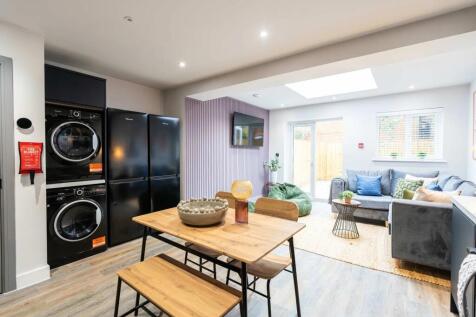 Bright and spacious living room featuring moder...