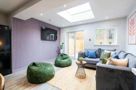 Bright and welcoming living room featuring a la...