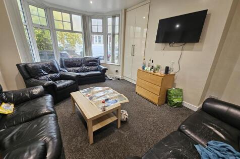 A spacious and inviting living room featuring c...