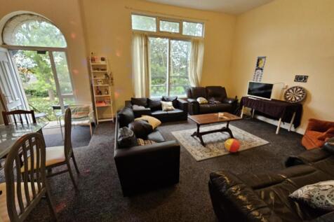 A spacious and inviting living room featuring c...