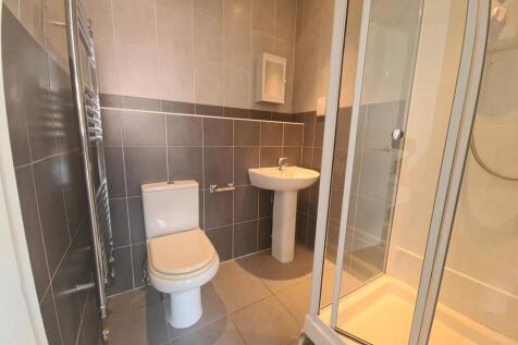 Modern bathroom suite featuring a clean and wel...