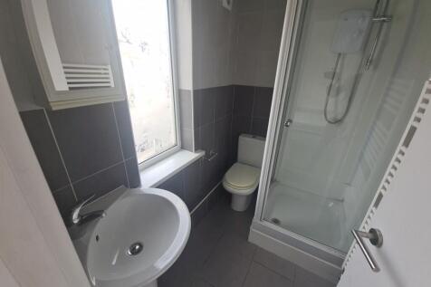 A neat and well-maintained bathroom featuring a...