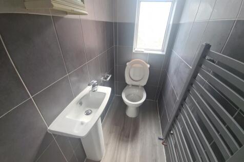 Bright and clean bathroom featuring modern grey...
