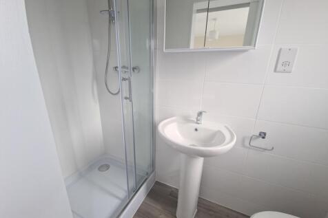 Bright and clean bathroom featuring a modern pe...