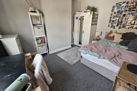 Bright and cozy double bedroom featuring a comf...