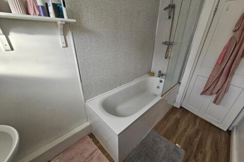 A neat and well-maintained bathroom featuring a...