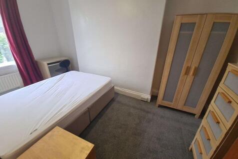 A bright and inviting double bedroom featuring ...