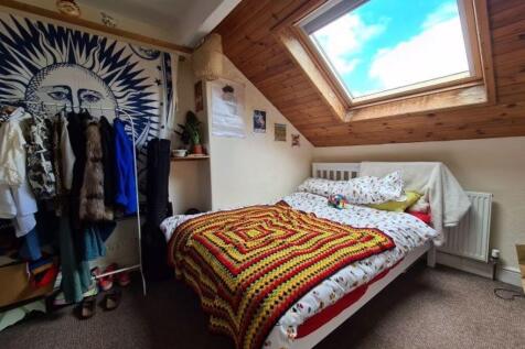Bright and cozy double bedroom with a skylight ...