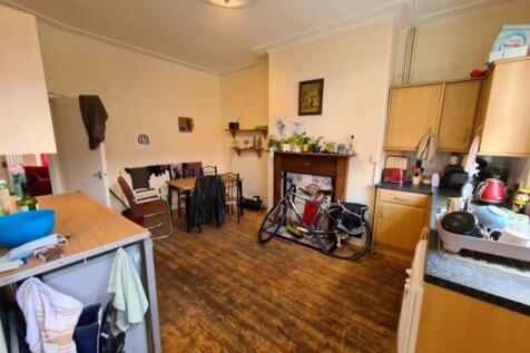 A warm and inviting kitchen space featuring woo...