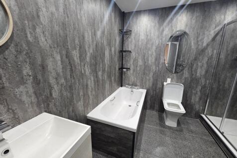 Modern and well-maintained bathroom featuring a...
